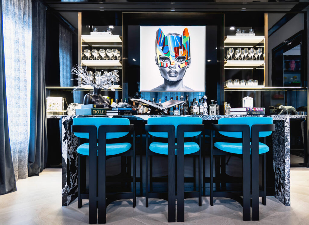 Bright bar with large artwork and colorful chairs