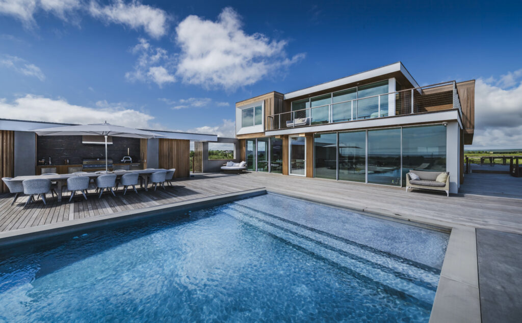 Dune road house, pool, outdoor kitchen, and deck area